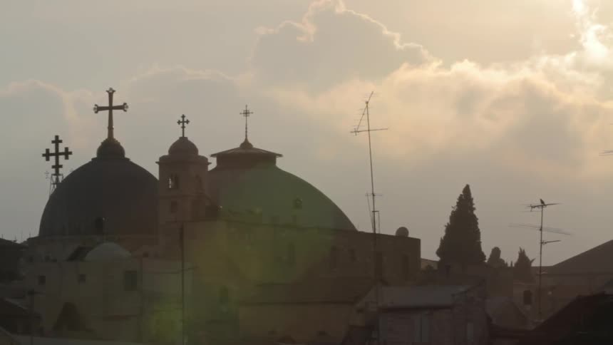 Clouds float over domed buildings