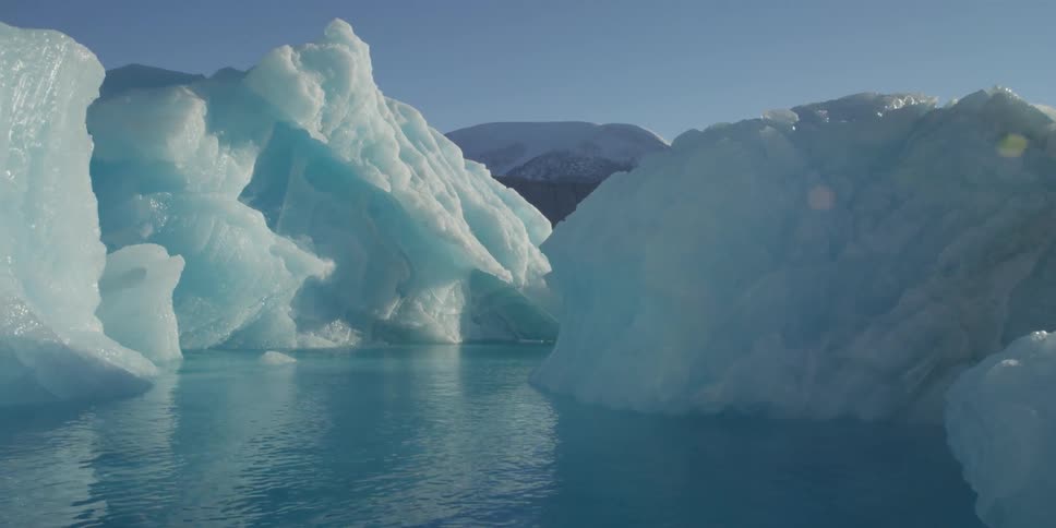 Glaciers and icebergs float in the ocean