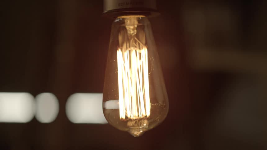 A light bulb blinks off and on