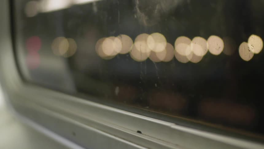 Lights are shown through a bus window