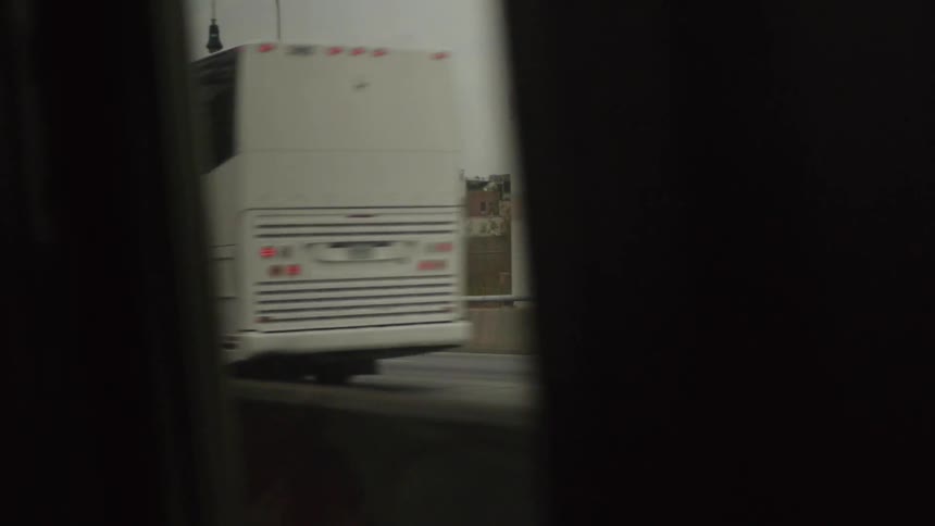 Traffic passing by a car window