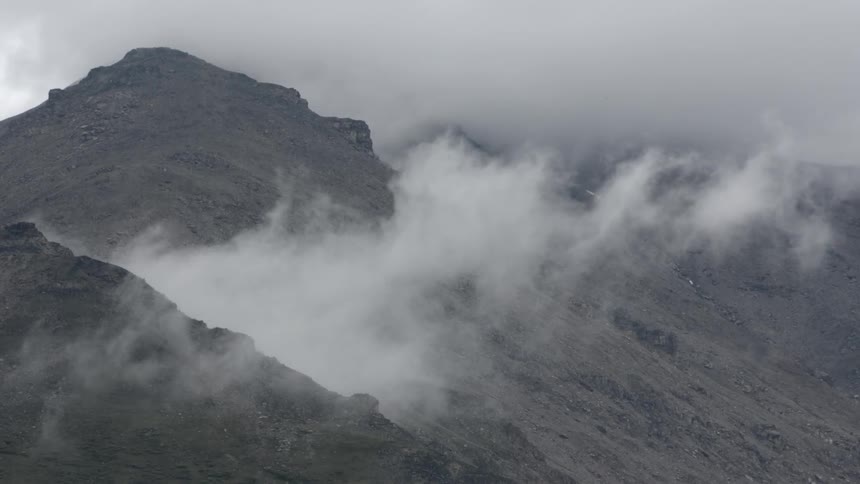 Clouds float over mountains