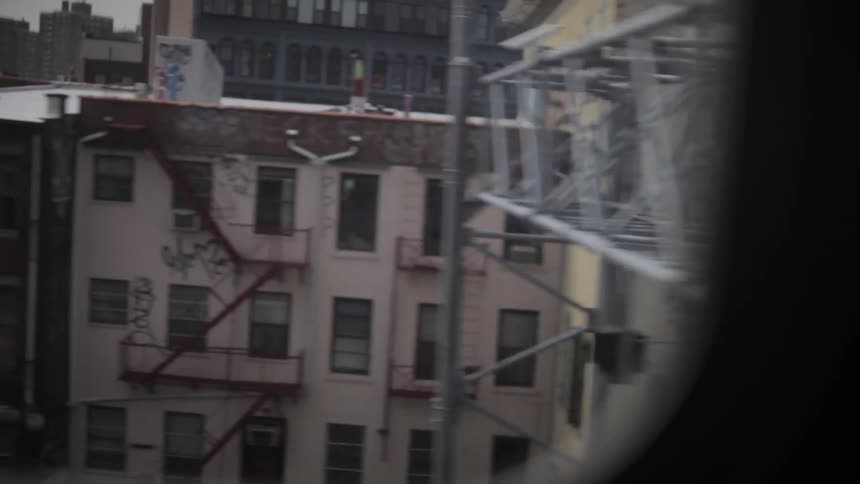 A train passes through an urban area