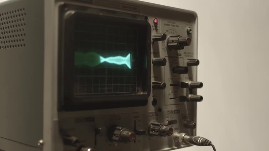 Random light patterns are shown on a monitor