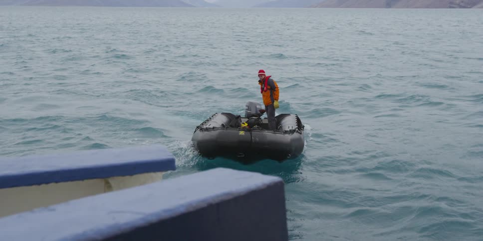 A man steers a raft