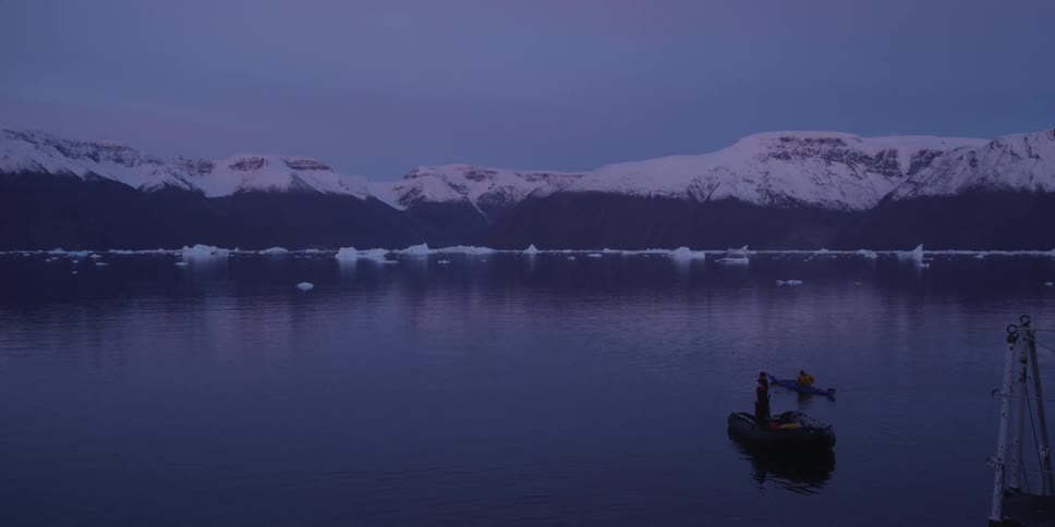 Two boats in the water at sunset