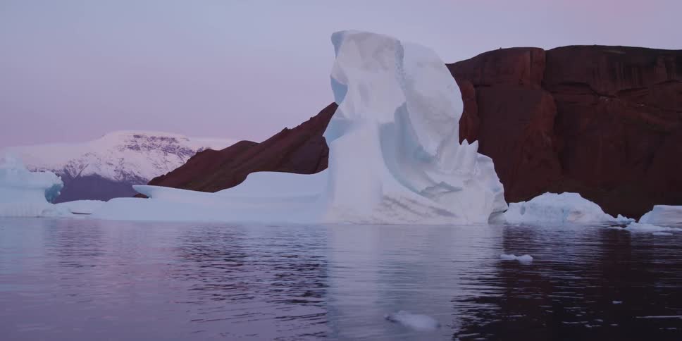 Water rushes by a glacier