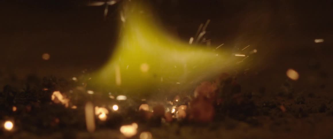 Sparks hit the ground in the dark
