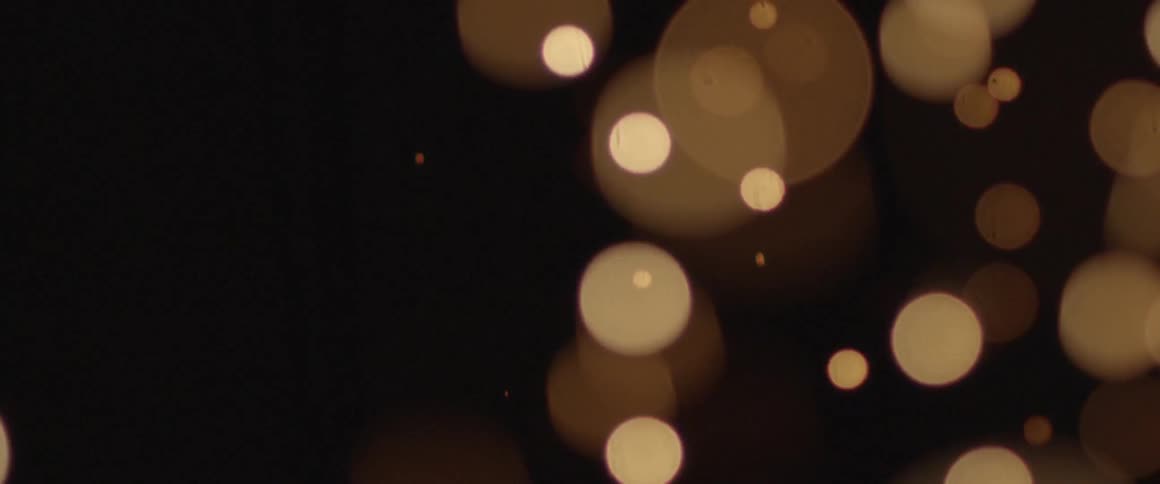 Dark area with small lights jumping up and down
