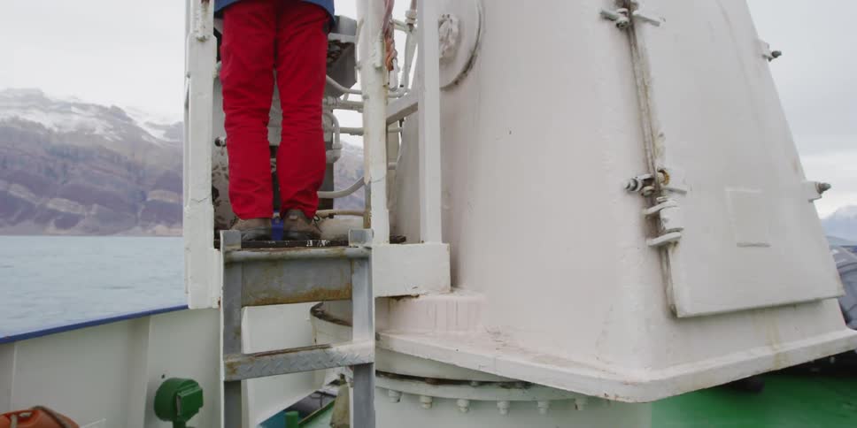A person standing on a crane