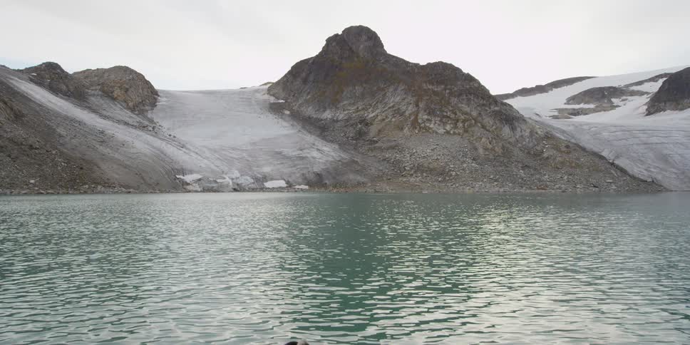 A rock formation on the water's edge