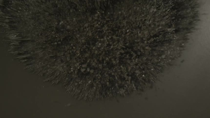 Minerals vibrate on a speaker