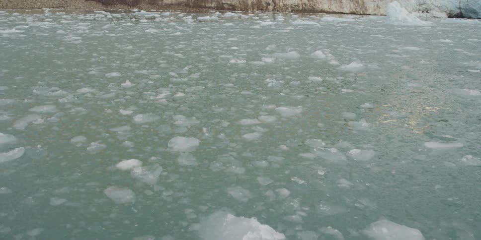Slushy water with big chunks of ice in it