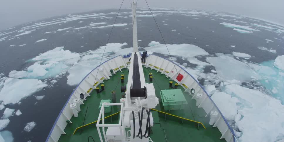 A boat sailing through icy water