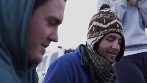 Friends looks down and talk to each other