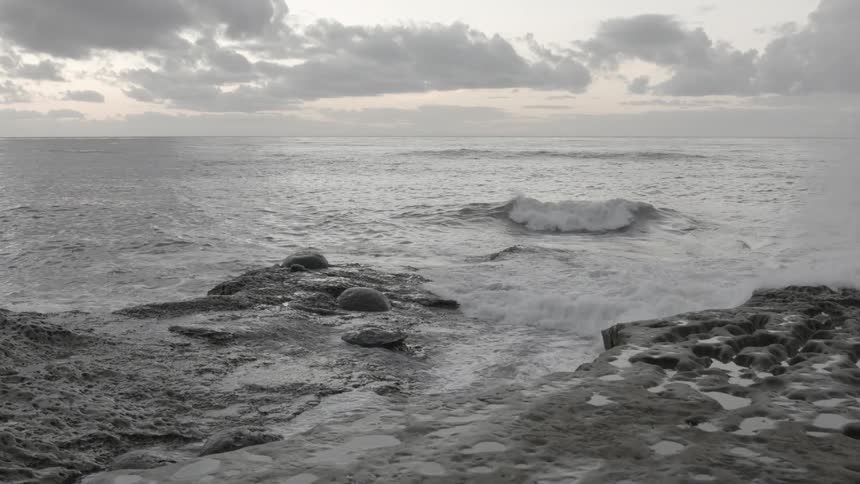 Water crashes against rocks