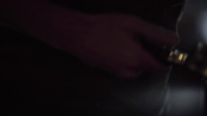 A man cleans off a tool