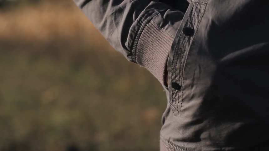 A person with their hands in their pockets