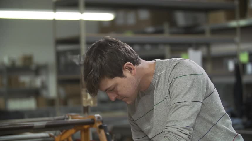 A man works on something