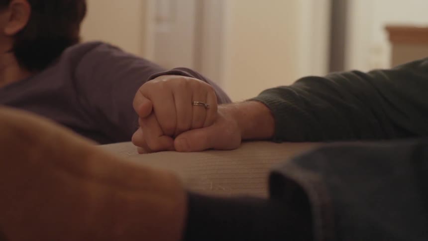 A couple holding hands