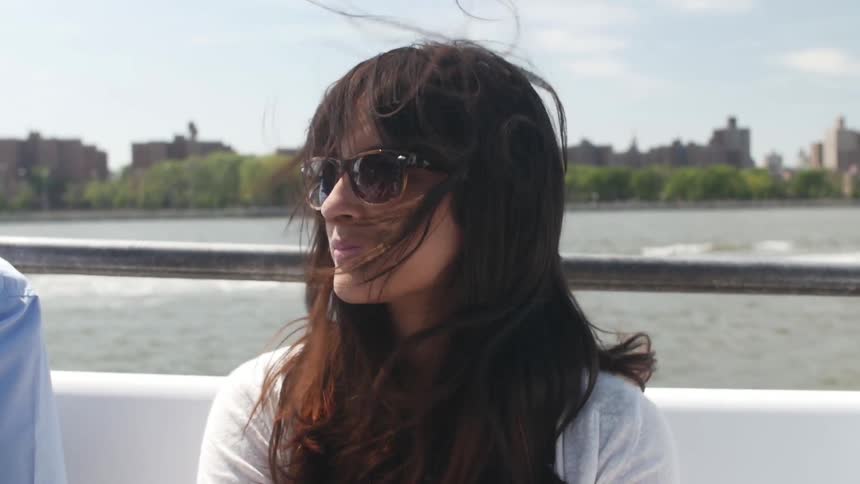Woman with sunglasses outside on windy day