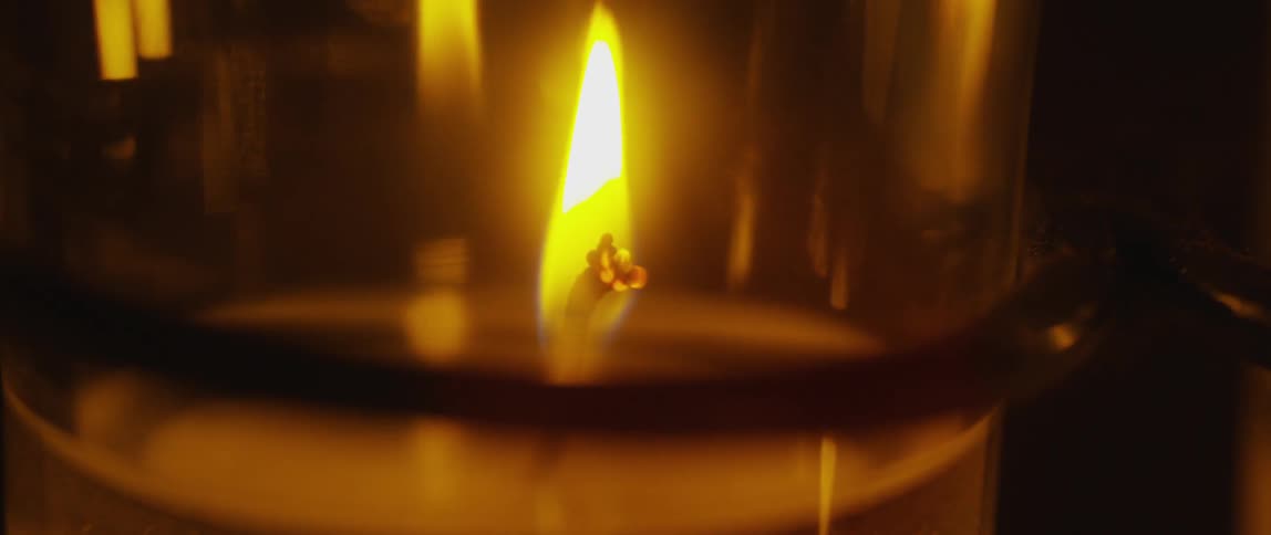 Flames burning on candle wicks