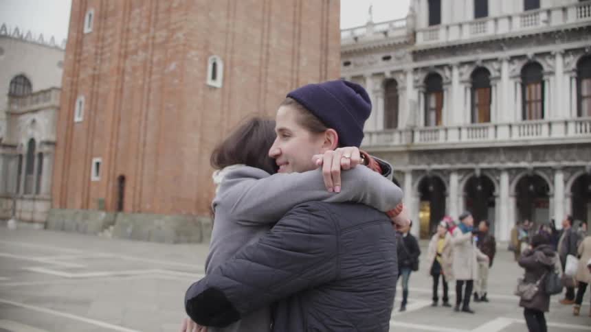 A man and woman hug