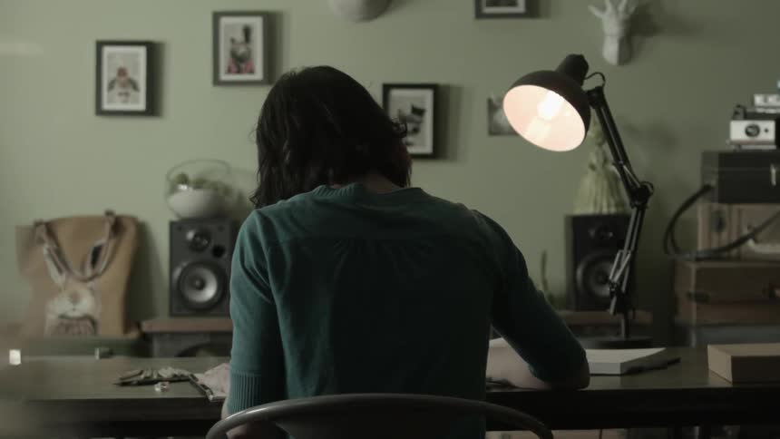 Woman sitting at a desk working at home