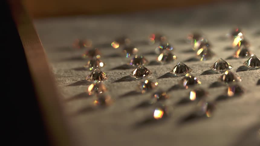 Surface with many shiny jewels laid across it