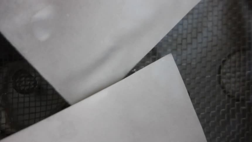 Paper being pushed into water