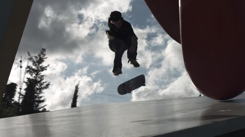 A man performs a skateboard trick