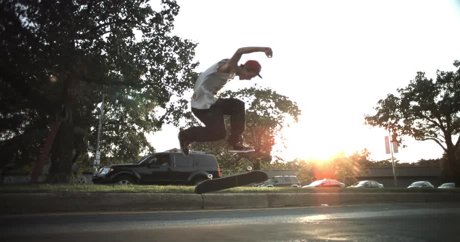 Man skateboarding as the sun sets