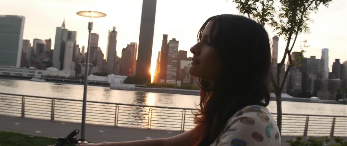A person walking next to a river