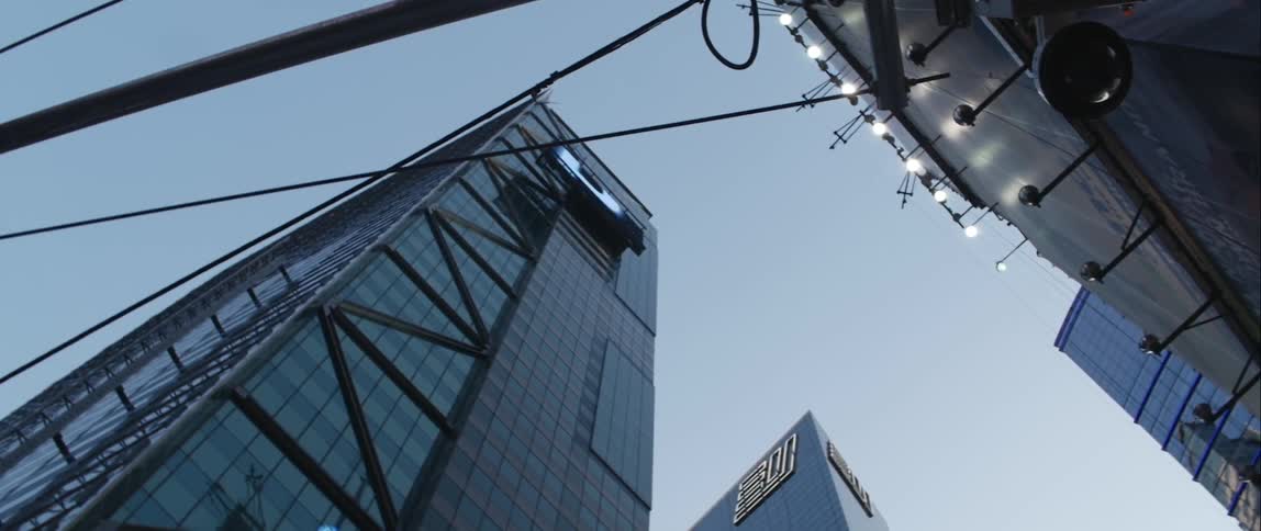 A skyscraper looms overhead