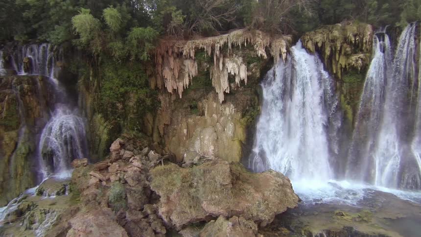 Water cascades over a cliff