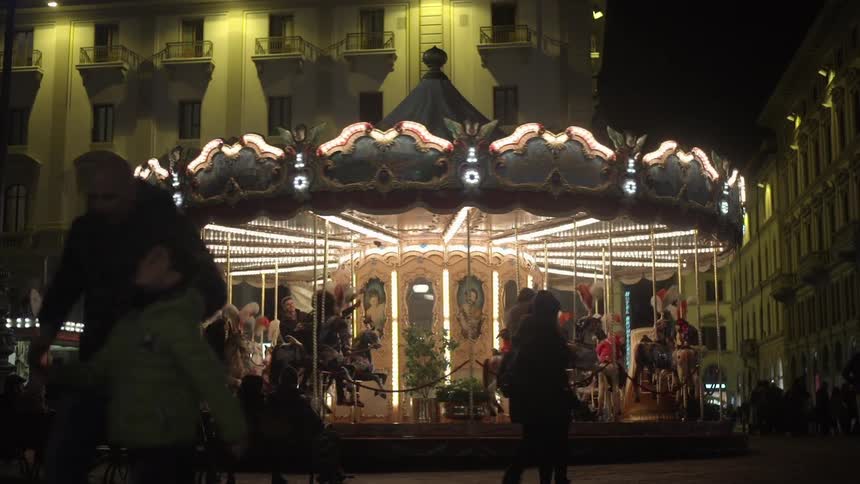 A carousel in a city at night