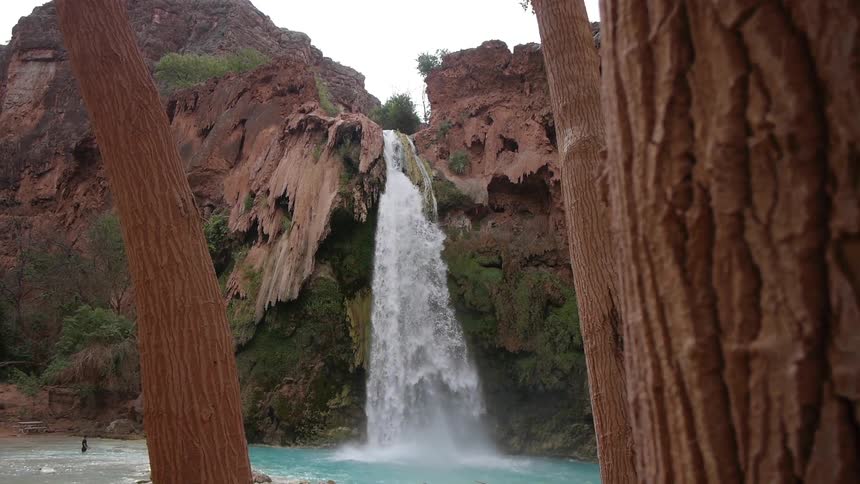 A waterfall cascades over a cliff