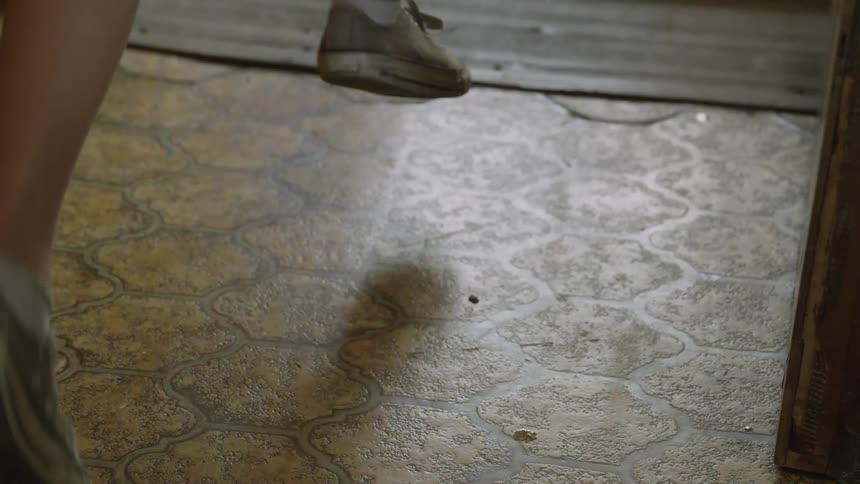 A child picks a book up from the floor