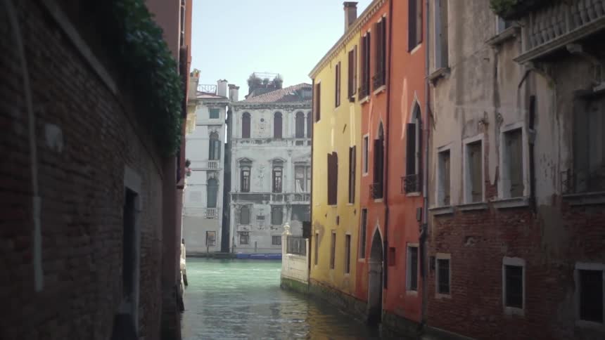 A canal flows through city buildings