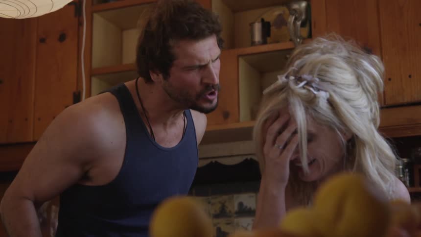 Man and woman arguing in a kitchen