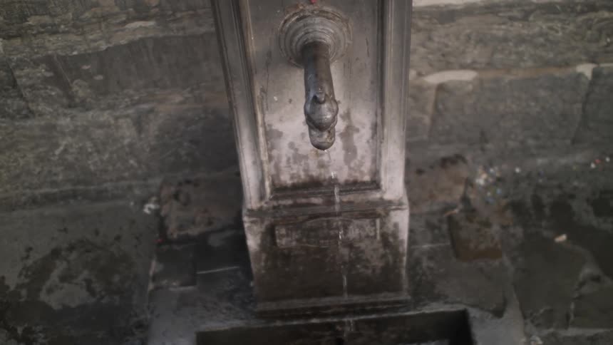 Water dripping from a faucet