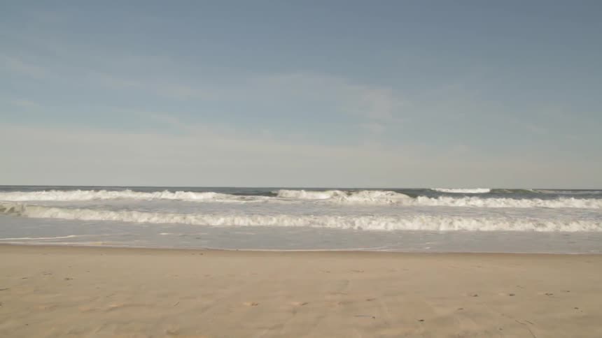 Waves rolling on to a beach