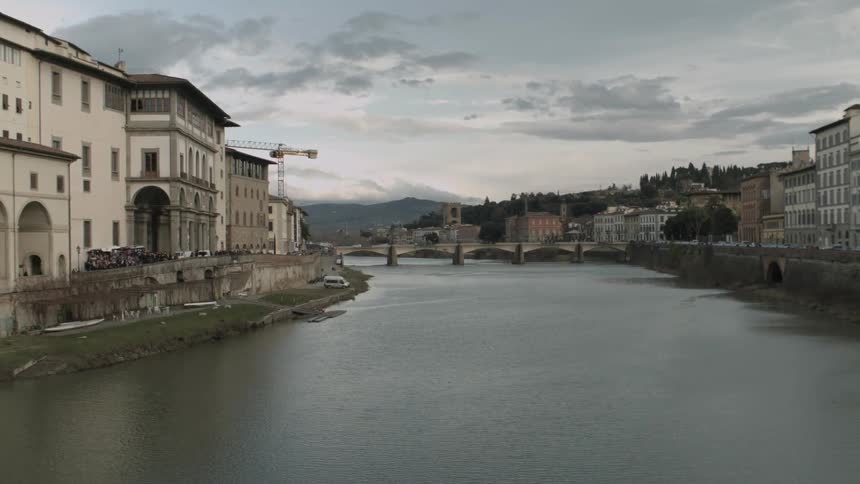 A village by a river on an overcast day