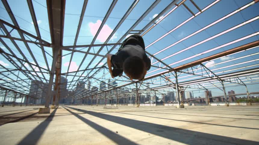 Man does a backflip on a sunny day
