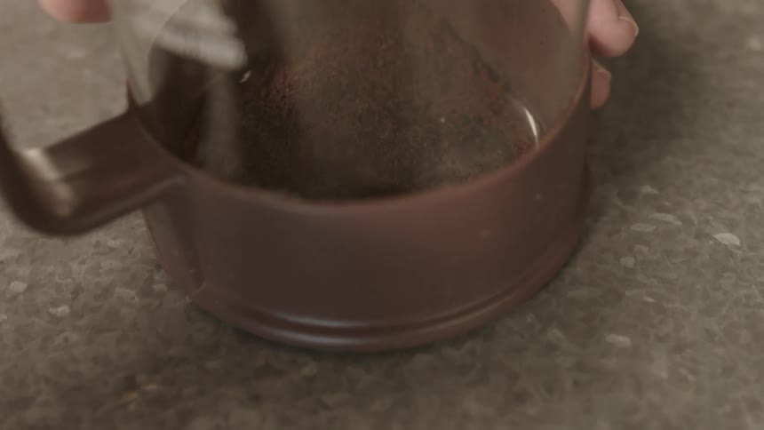 Coffee being poured into a pitcher