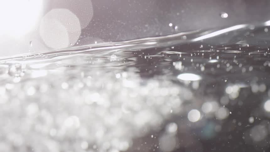 Water moving around creating small bubbles
