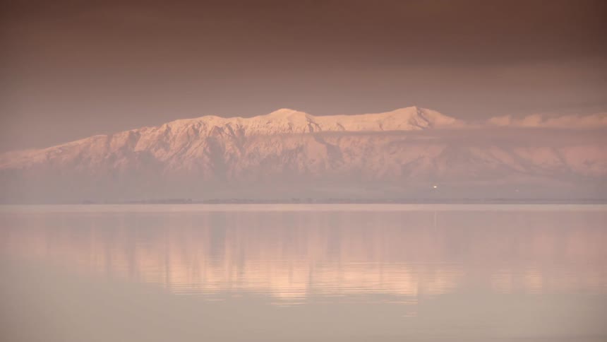 A lake overlooking a mountain