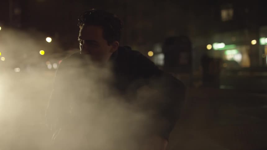 A person standing in smoke