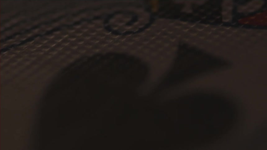 Close up of the spade on a playing card