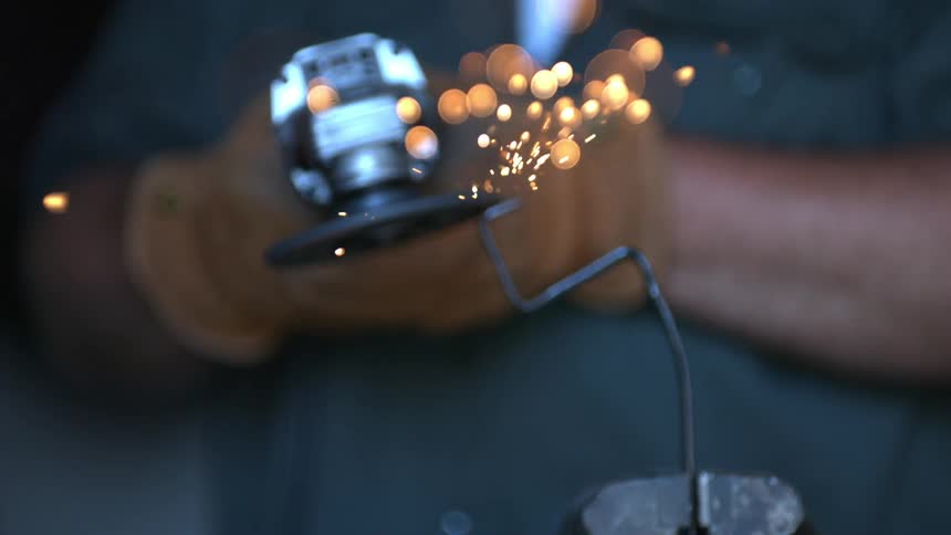 Sparks fly from a metal grinder